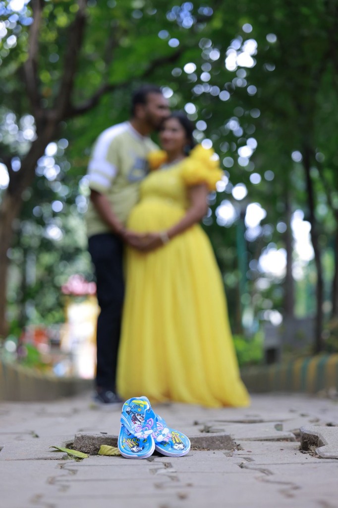 Maternity photography — baby shoes in focus, Usha Photo Studio